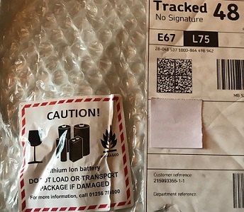 Label stuck on outer packaging depicting the danger posed by lithium-ion batteries