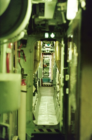 The claustrophobic interior inside a submarine. Photo by Taylor Vatem on free photo website Unsplash