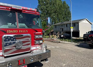 Idaho Falls firefighters respond to the garage fire caused by a lithium ion battery. Photo from Idaho Falls Fire Department.